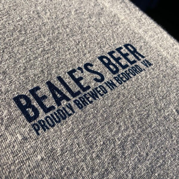 Beale's Beer Proudly Brewed In Bedford, VA logo in navy ink on a heather tee at RVA Threads screen printing, Virginia