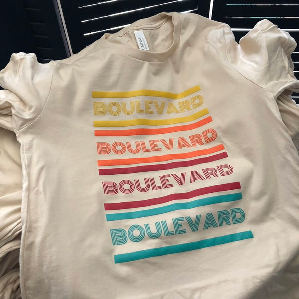 Boulevard retro stripe design in orange, red and teal ink on a natural tee at RVA Threads screen printing, Virginia