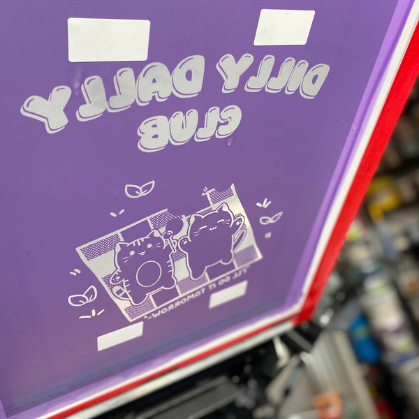Dilly Dally Club cats design screen with white ink on the press at RVA Threads screen printing, Virginia