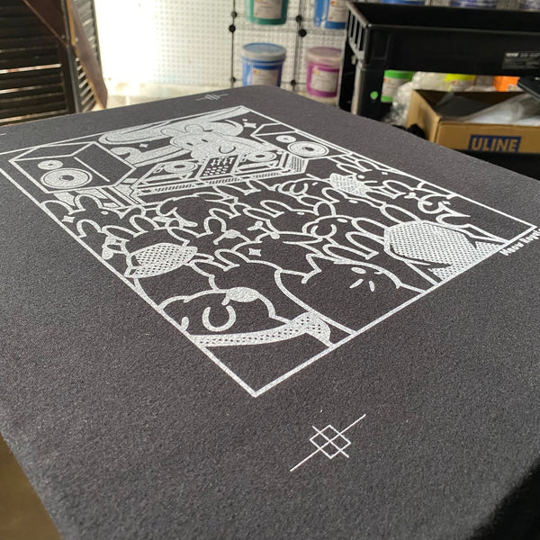 DJ bunny design white underbase test print on a gray press pallet at RVA Threads screen printing, Virginia