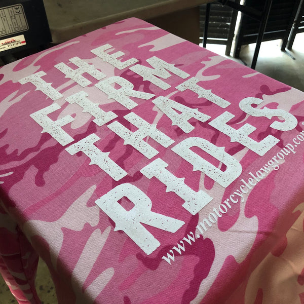 The Firm That Rides lettering in white ink on a pink camo tee at RVA Threads screen printing, Virginia
