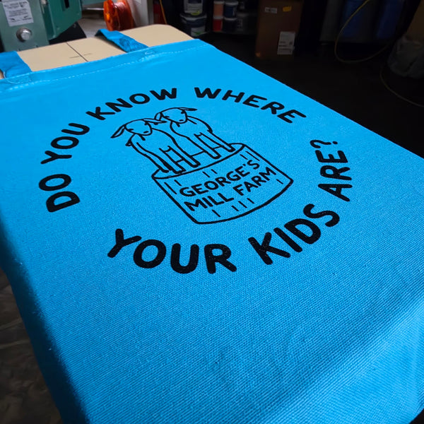 George's Mill Farm Do You Know Where Your Kids Are tote bag printed in black ink on turquoise at RVA Threads screen printing, Virginia