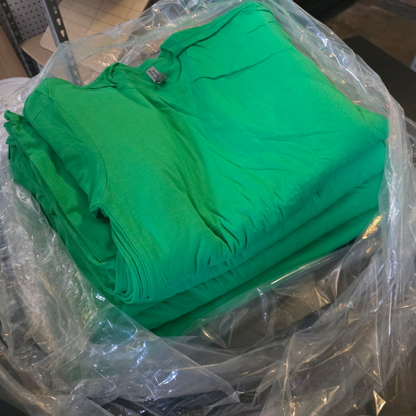 Blank kelly green Next Level 3600 tees for the George's Mill Farm Goat-Topia order, still in the bag at RVA Threads screen printing, Virginia