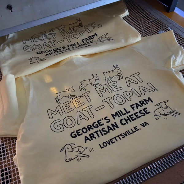George's Mill Farm Meet Me at Goat-Topia yellow shirts, black ink, riding the conveyor dryer belt at RVA Threads screen printing, Virginia