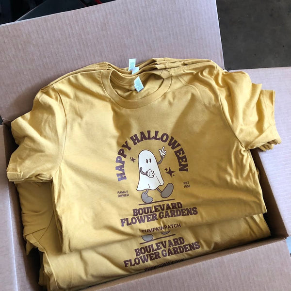 Happy Halloween Boulevard Flower Gardens ghost design on gold tees, packed in a box at RVA Threads screen printing, Virginia