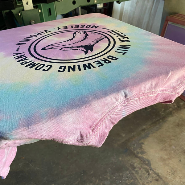 Hidden Wit Brewing Company Moseley, Virginia logo in black ink on a pastel tie-dye tee at RVA Threads screen printing, Virginia