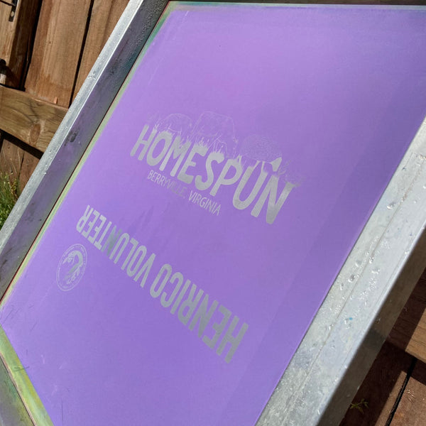 Burned screen with the Homespun and Henrico Volunteer designs propped up to dry at RVA Threads screen printing, Virginia