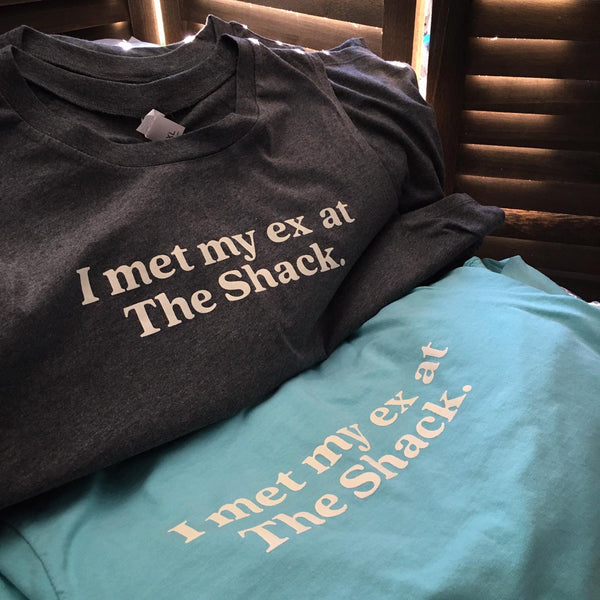 I Met My Ex At The Shack lettering in cream ink on charcoal and teal tees at RVA Threads screen printing, Virginia