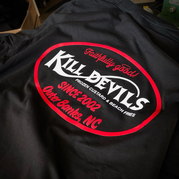 Kill Devils Outer Banks, NC logo in red and white ink on a black tee at RVA Threads screen printing, Virginia
