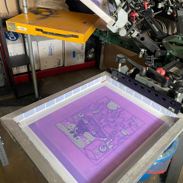 Meow Royale DJ bunny screen set in the press clamps above the pallet at RVA Threads screen printing, Virginia