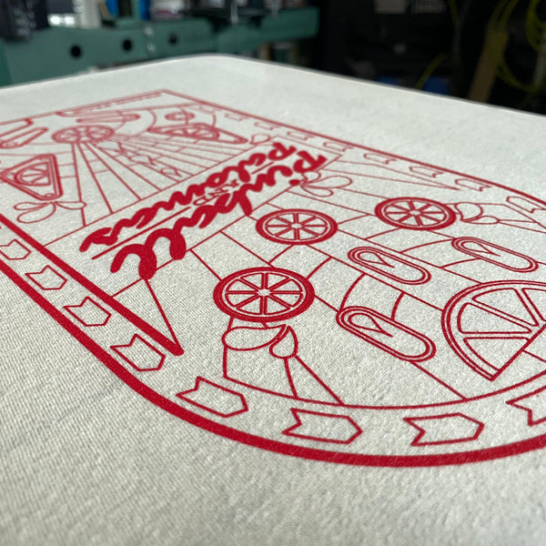 Pinball Palomas pinball machine design printed in red ink on natural fabric at RVA Threads screen printing, Virginia