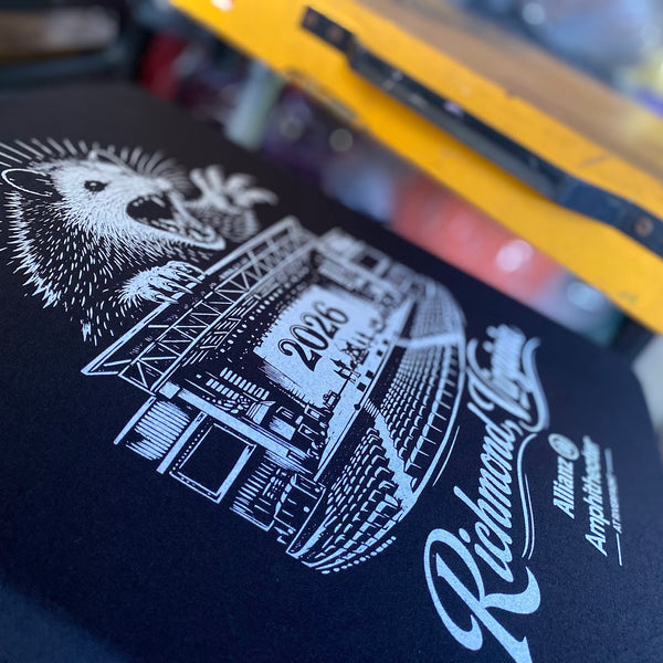 Richmond, Virginia opossum design for Allianz Amphitheater on a black tee under the flash at RVA Threads screen printing, Virginia