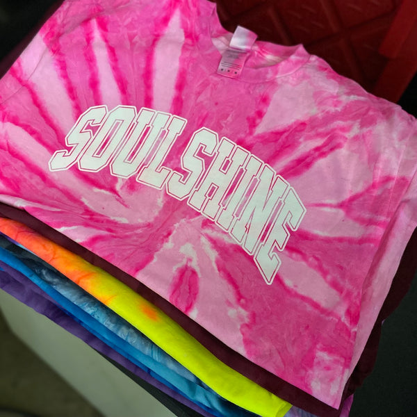 Soulshine arch lettering in white ink on pink tie-dye tees, stacked after printing at RVA Threads screen printing, Virginia