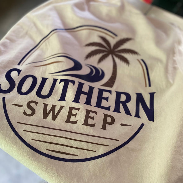 Southern Sweep palm tree logo in navy ink on a natural tee, close up after printing at RVA Threads screen printing, Virginia