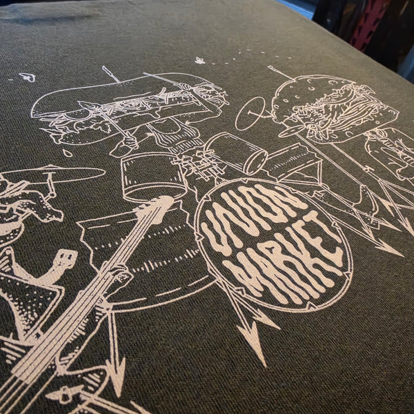 Union Market sandwich band drum kit and guitarist close up in white ink on a Pepper Comfort Colors tee at RVA Threads screen printing, Virginia