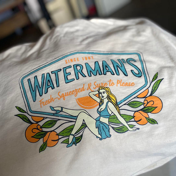 Waterman's Fresh Squeezed pin-up design in orange and blue ink on a white tee at RVA Threads screen printing, Virginia