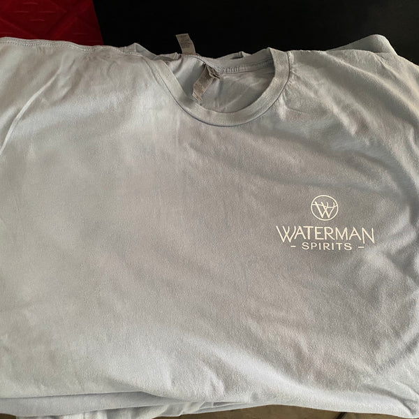 Waterman's left chest print on light blue tees, folded and stacked at RVA Threads screen printing, Virginia