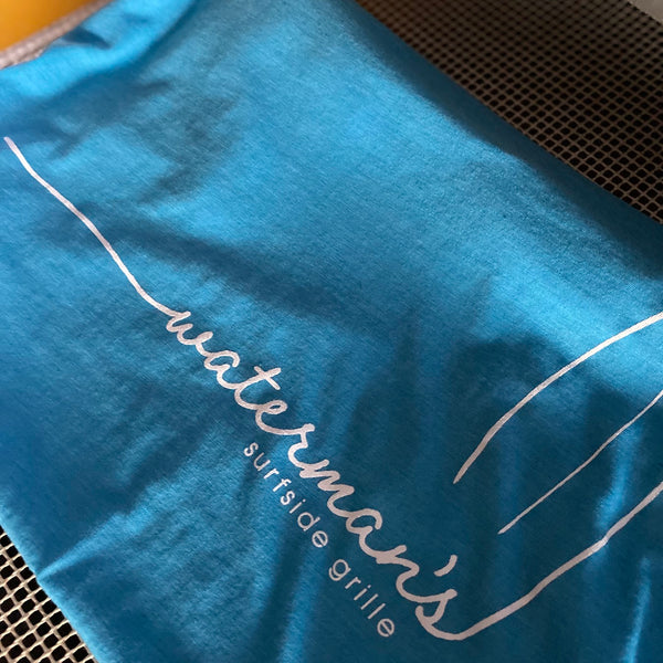 Waterman's Surfside Grille script logo in white ink on a blue tee at RVA Threads screen printing, Virginia