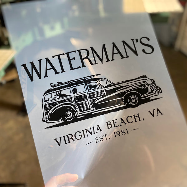 Waterman's Virginia Beach woody wagon film positive held up to the light at RVA Threads screen printing, Virginia