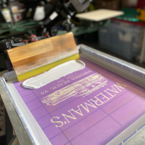 Waterman's Virginia Beach woody wagon screen with white ink and the squeegee on the press at RVA Threads screen printing, Virginia