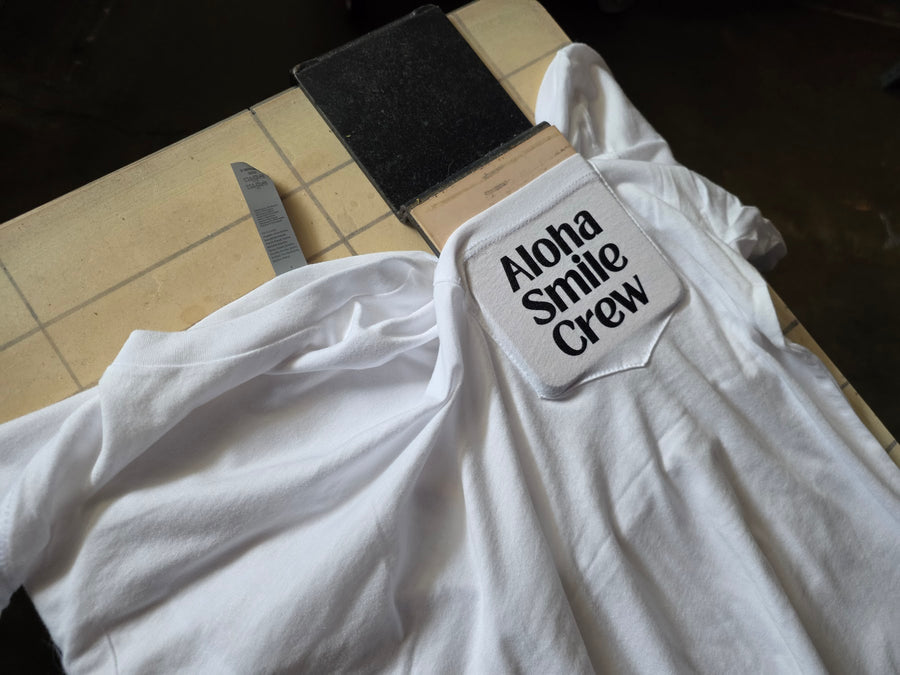 Aloha Smile Crew pocket print on a white shirt at RVA Threads screen printing, Virginia