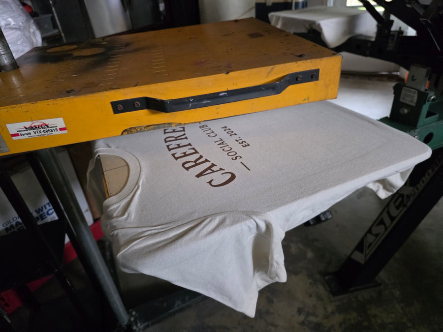 Carefree Social Club shirt under the flash dryer at RVA Threads screen printing, Virginia