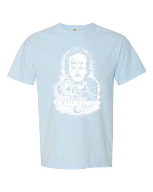 Chambray Comfort Colors 1717 t-shirt with a white Four-Eyed Poe design by Burrito Breath, Edgar Allan Poe with a raven and a skull on books, screen printed by RVA Threads
