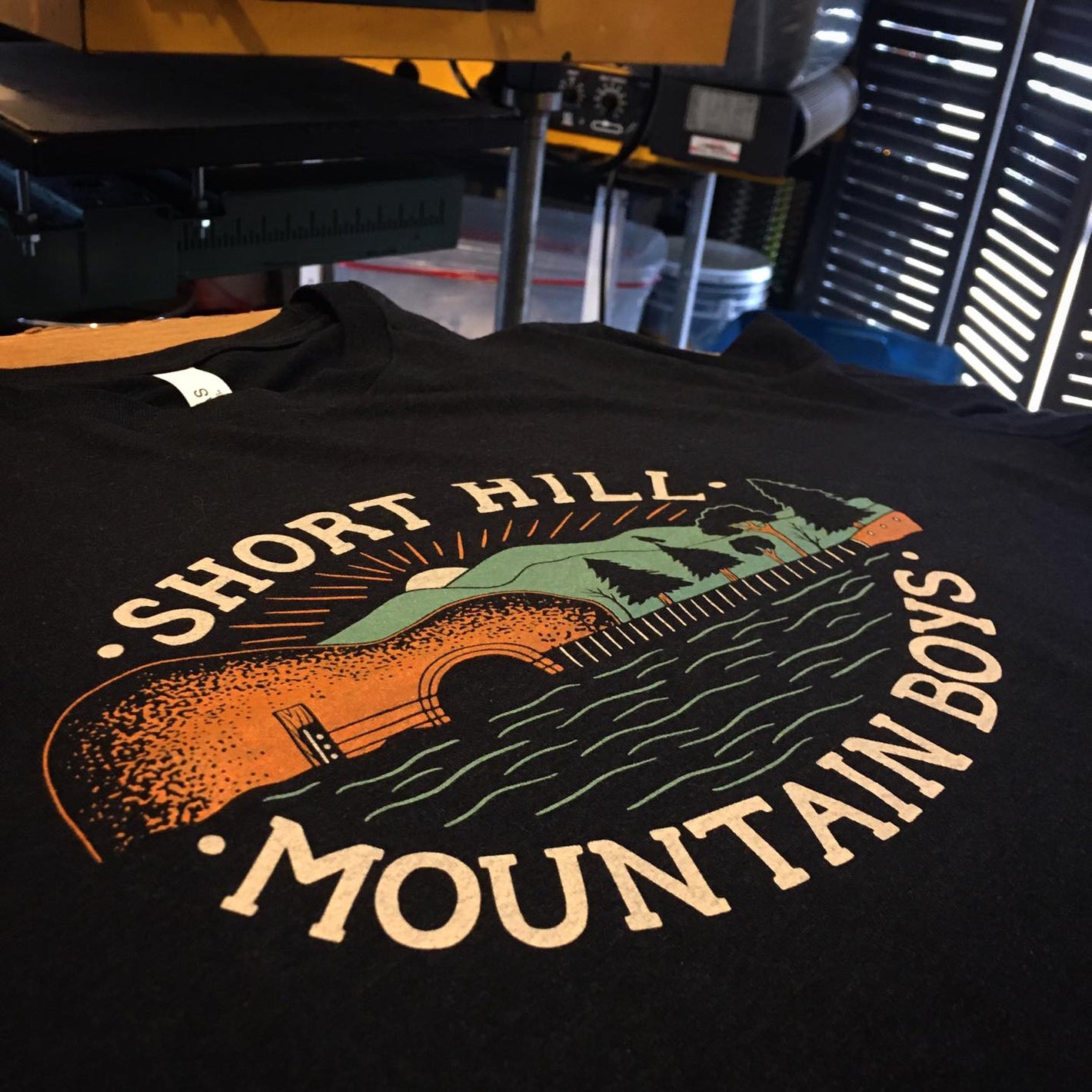 Custom screen printed t-shirts for Short Hill Mountain Boys band, features guitar. 