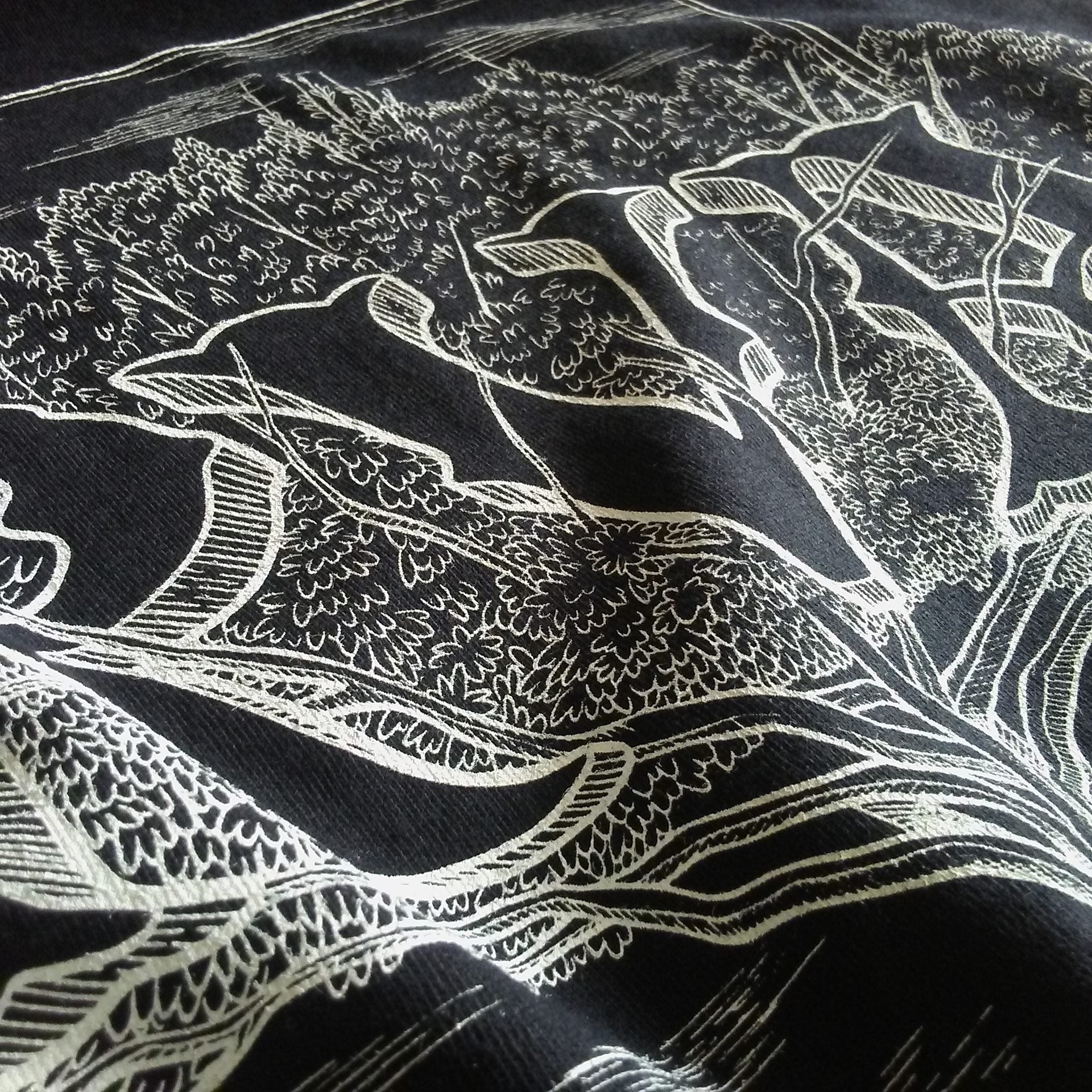 RVA rooted design screen printed on black t-shirt.