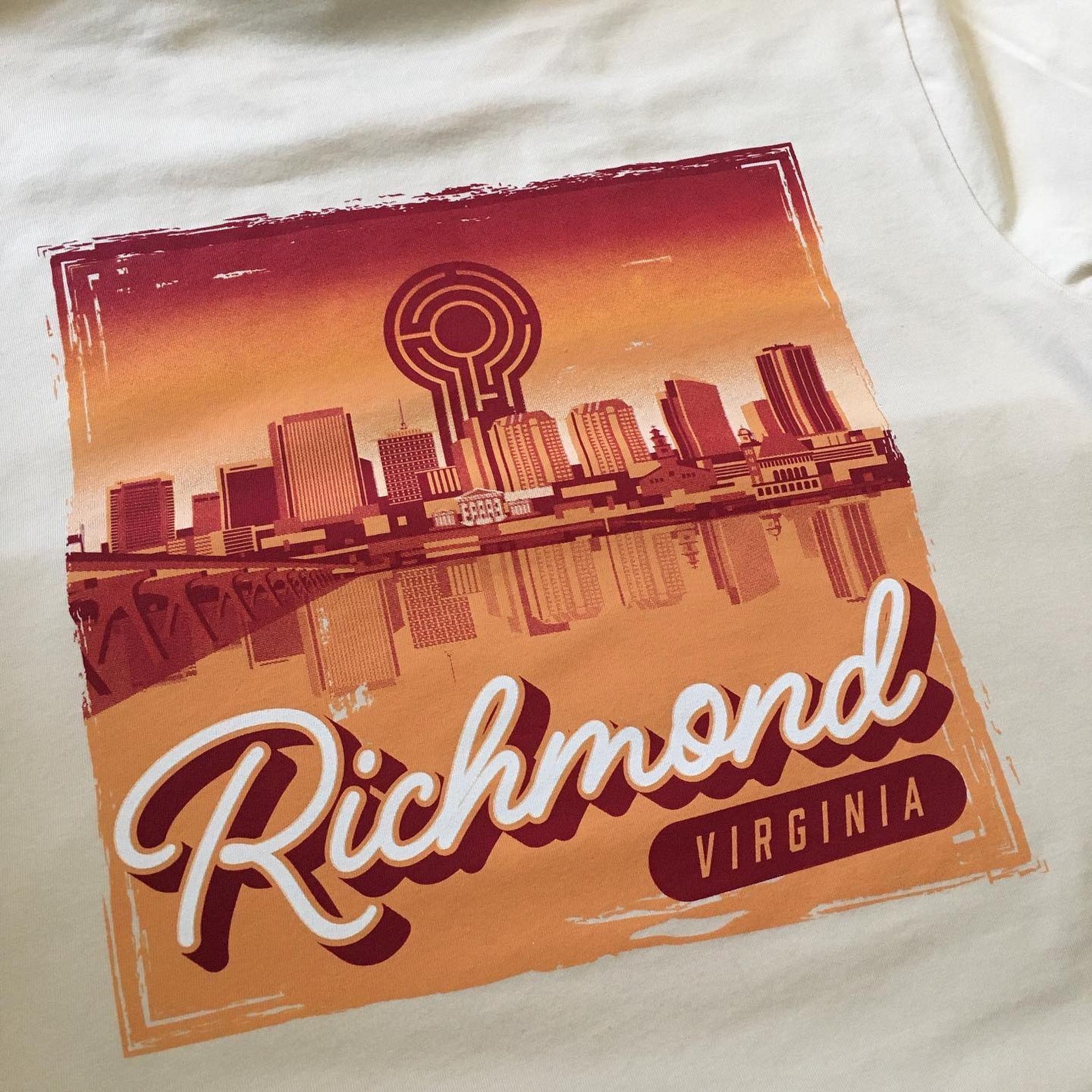 Richmond, Virginia skyline screen printed on Bella Canvas vintage white t-shirt.
