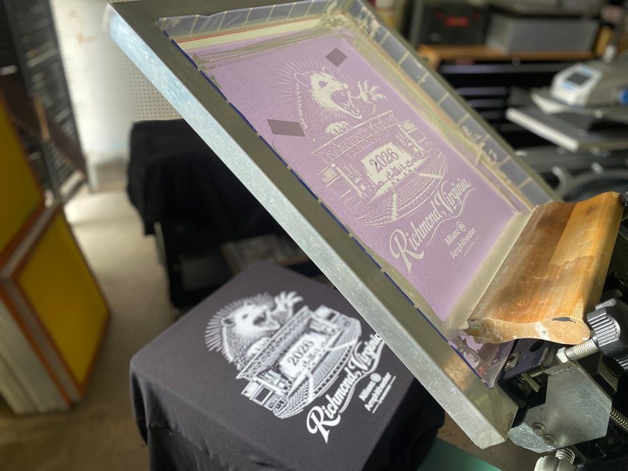 Richmond, Virginia screen and printed black shirts on press at RVA Threads screen printing, Virginia