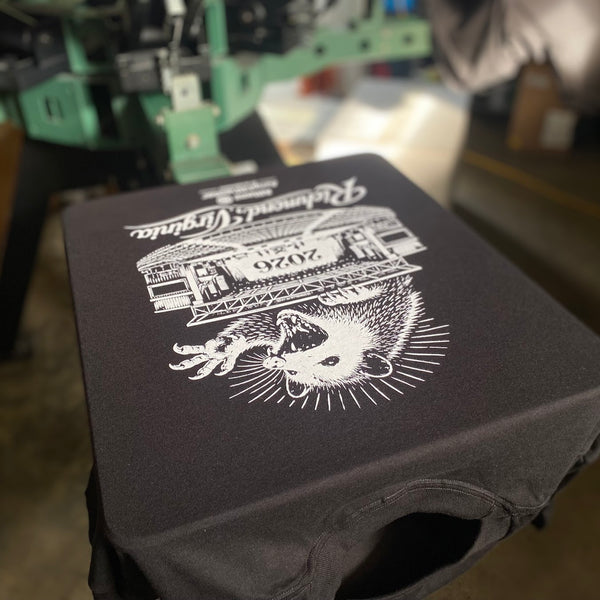 Richmond, Virginia design printed on a black shirt on press at RVA Threads screen printing, Virginia