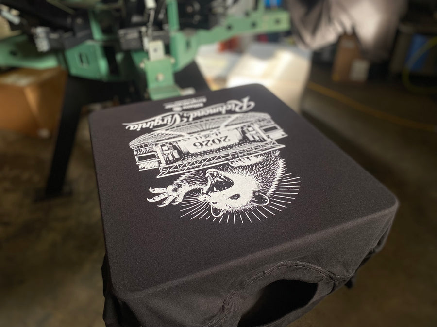 Richmond, Virginia design printed on a black shirt on press at RVA Threads screen printing, Virginia