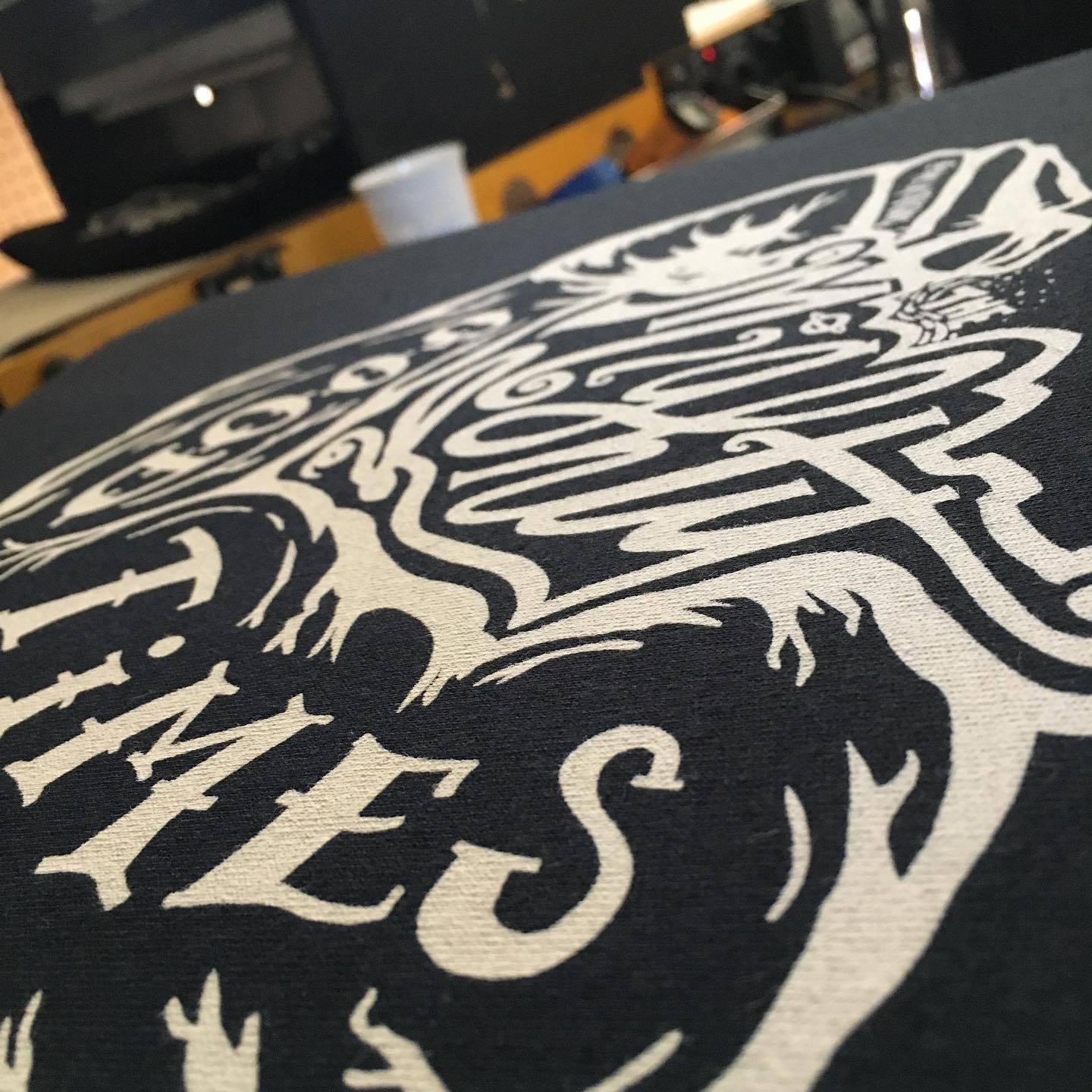Close up photo of custom screen printed t-shirt for The Mighty Good Times band in Richmond, Virginia.