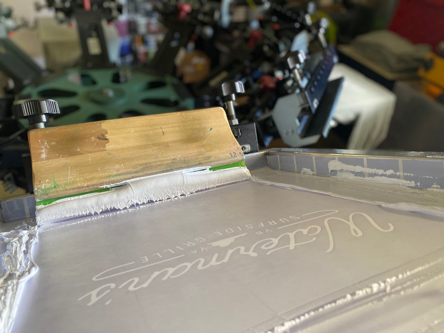 Waterman's screen with white ink and squeegee at RVA Threads screen printing, Virginia