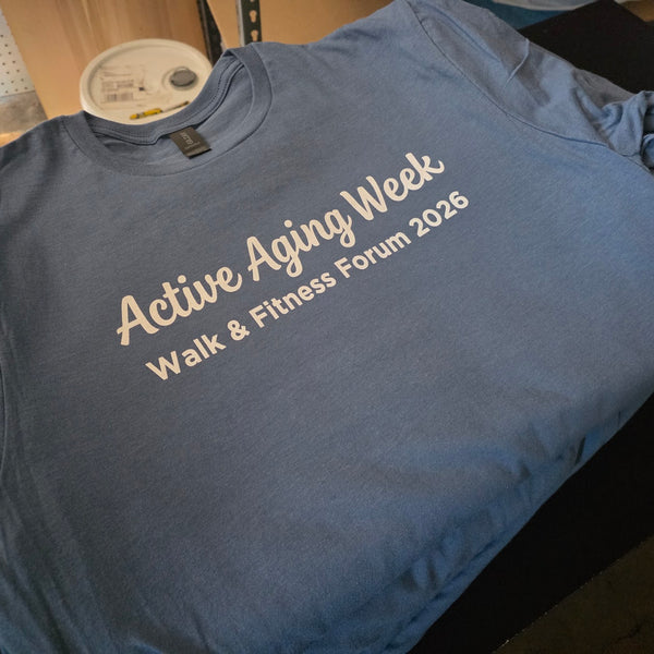 Active Aging Week Walk and Fitness Forum 2026 tees in blue with white ink, printed and folded in a stack at RVA Threads screen printing, Virginia