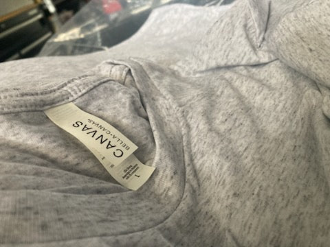 Blank ash heather Bella+Canvas tee with the collar tag showing, ready to print at RVA Threads screen printing, Virginia