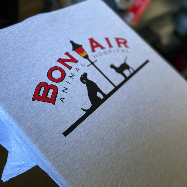 Bon Air Animal Hospital logo in red and black ink on a white heather tee at RVA Threads screen printing, Virginia