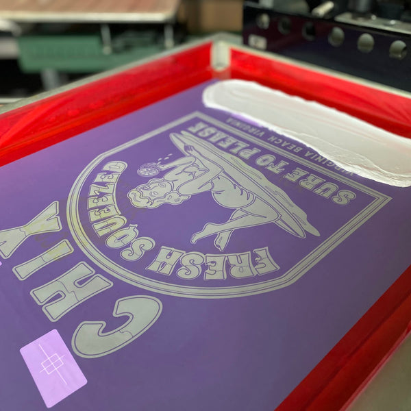 Chix Fresh Squeezed screen with white ink and the squeegee on the press at RVA Threads screen printing, Virginia
