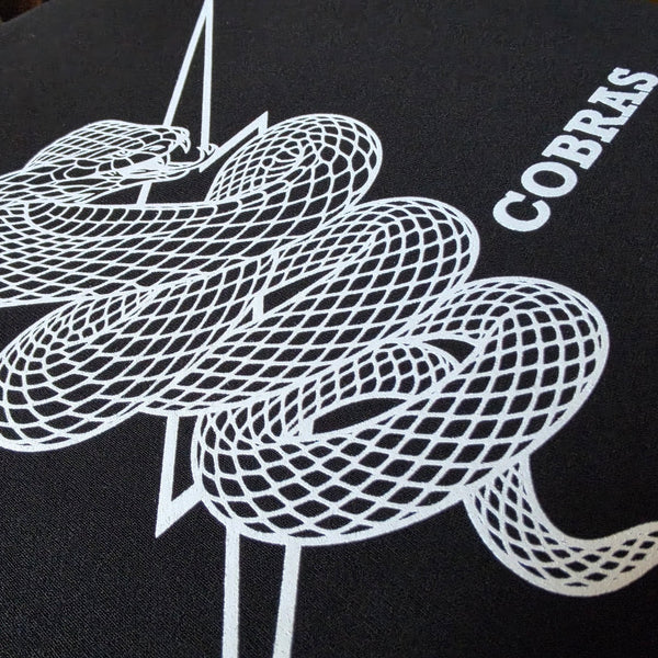 Cobras design printed in white ink on a black Independent Trading SS3000 crewneck sweatshirt at RVA Threads screen printing, Virginia