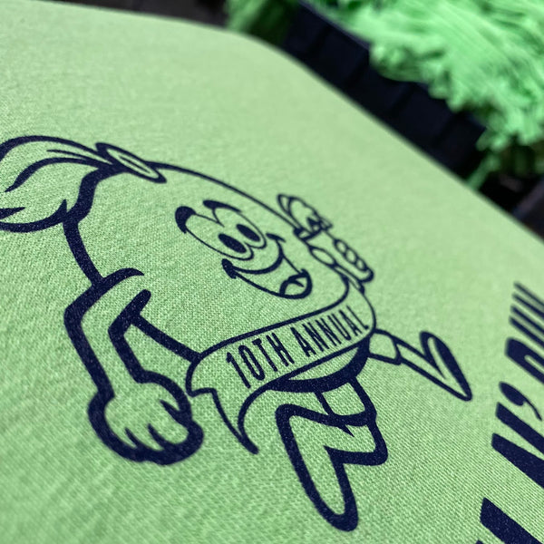Crush Run 10th Annual mascot in navy ink on a mint tee, close up at RVA Threads screen printing, Virginia