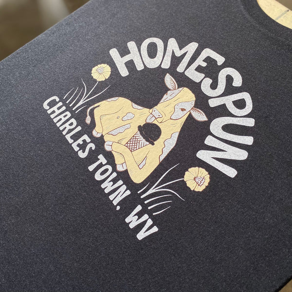 Homespun Charles Town, WV cow design in white and gold ink on a navy tee at RVA Threads screen printing, Virginia