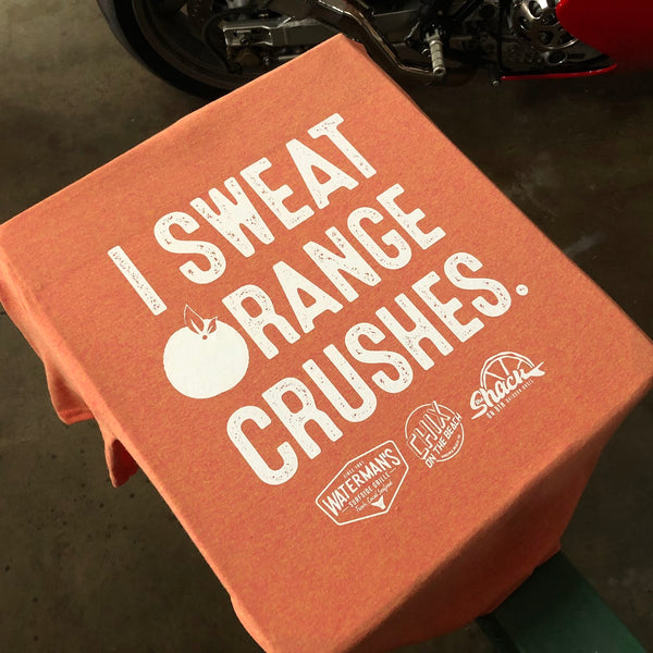 I Sweat Orange Crushes lettering in white ink on an orange tee at RVA Threads screen printing, Virginia