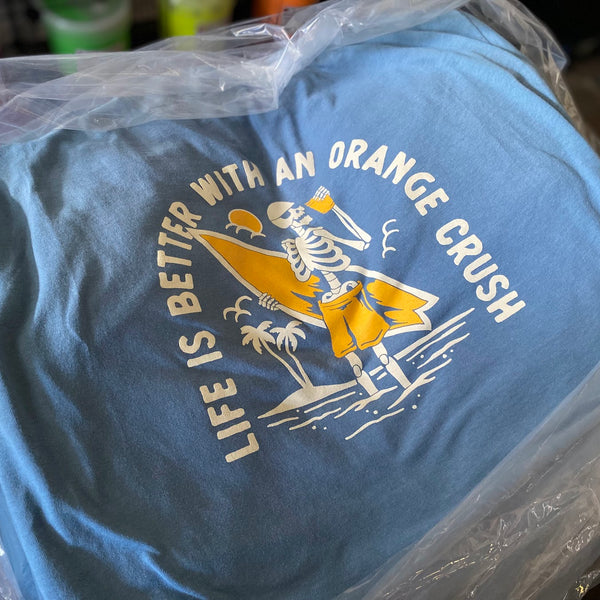 Life Is Better With An Orange Crush design on a heather blue tee, still in the bag at RVA Threads screen printing, Virginia