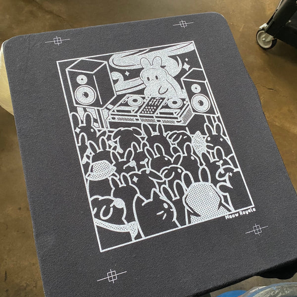 Meow Royale DJ bunny white underbase printed on a gray press pallet at RVA Threads screen printing, Virginia