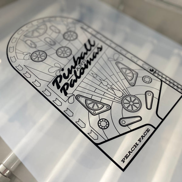 Pinball Palomas pinball machine film positive laid out before burning the screen at RVA Threads screen printing, Virginia