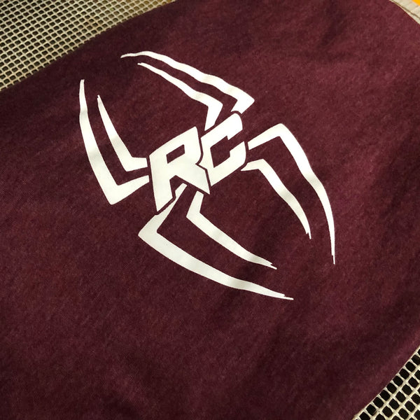 RC spider logo in white ink on a heather maroon tee, laid flat after printing at RVA Threads screen printing, Virginia