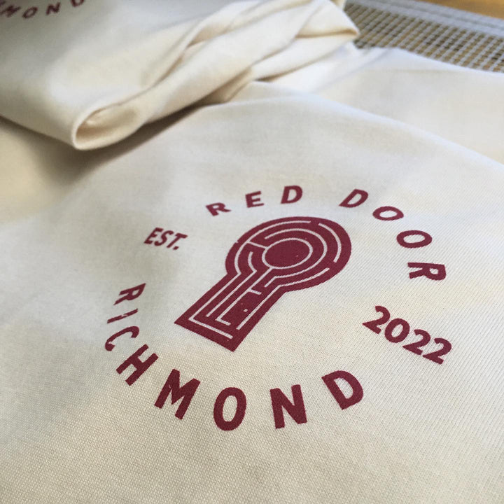 Finished Red Door Escape Room t-shirt, screen printed by RVA Threads