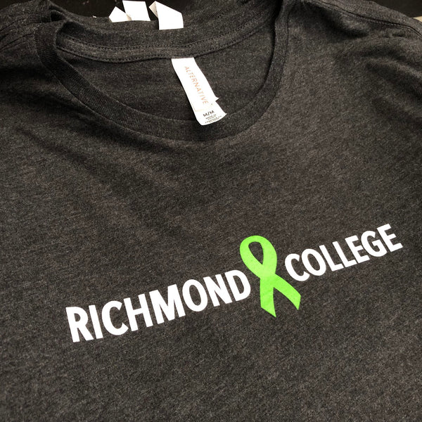 Richmond College green ribbon logo in white and green ink on a charcoal tee at RVA Threads screen printing, Virginia