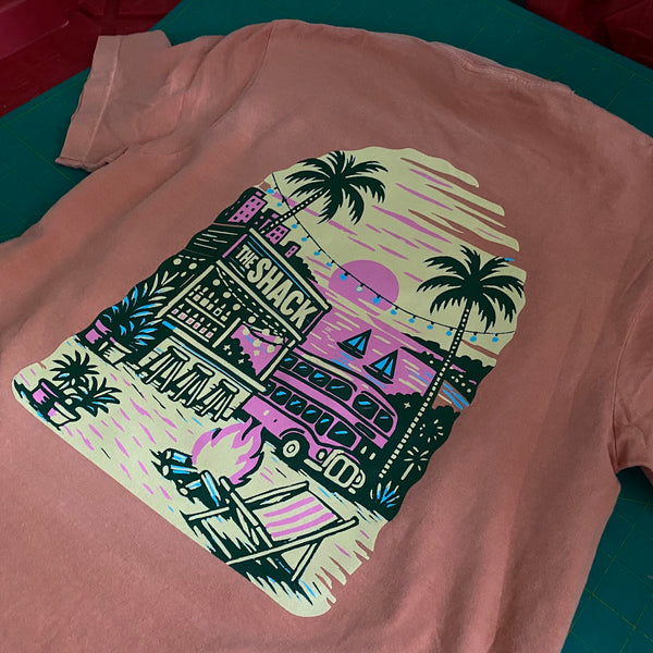 The Shack beach scene back print in full color on a peach tee at RVA Threads screen printing, Virginia